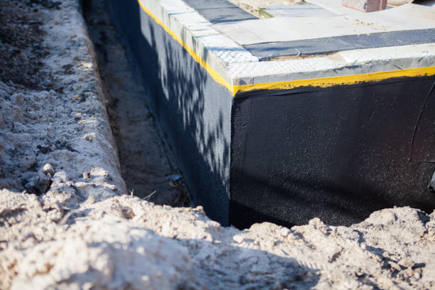 Professional Waterproofing technician working in Madison, NC